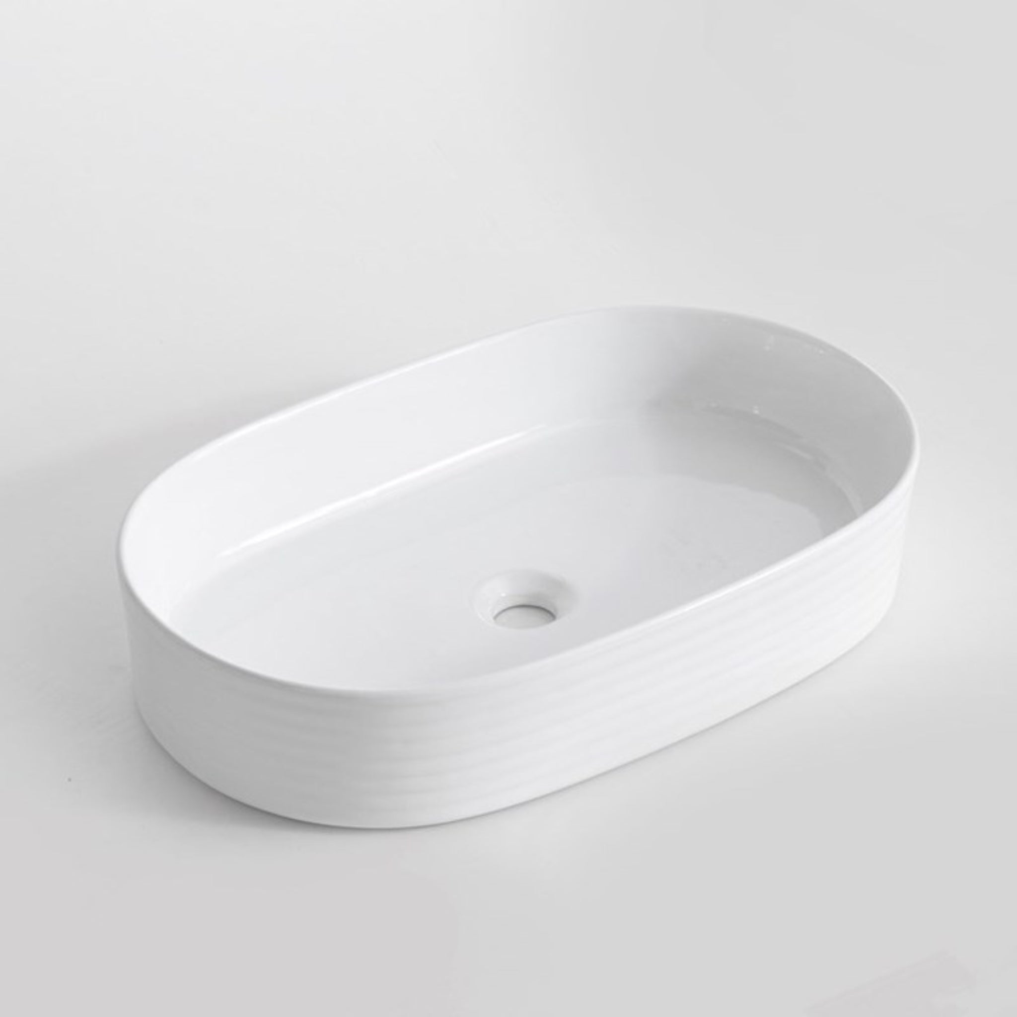 AQUAPERLA CERAMIC FLUTED OVAL ABOVE COUNTER BASIN GLOSS WHITE 605MM